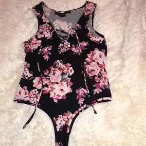 Onesie black and pink flowers size small like new